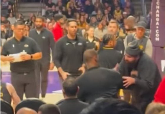 Fan gets kicked out after putting arms around LeBron James
