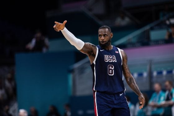 LeBron James scolds a kid waiting to take a photo with him